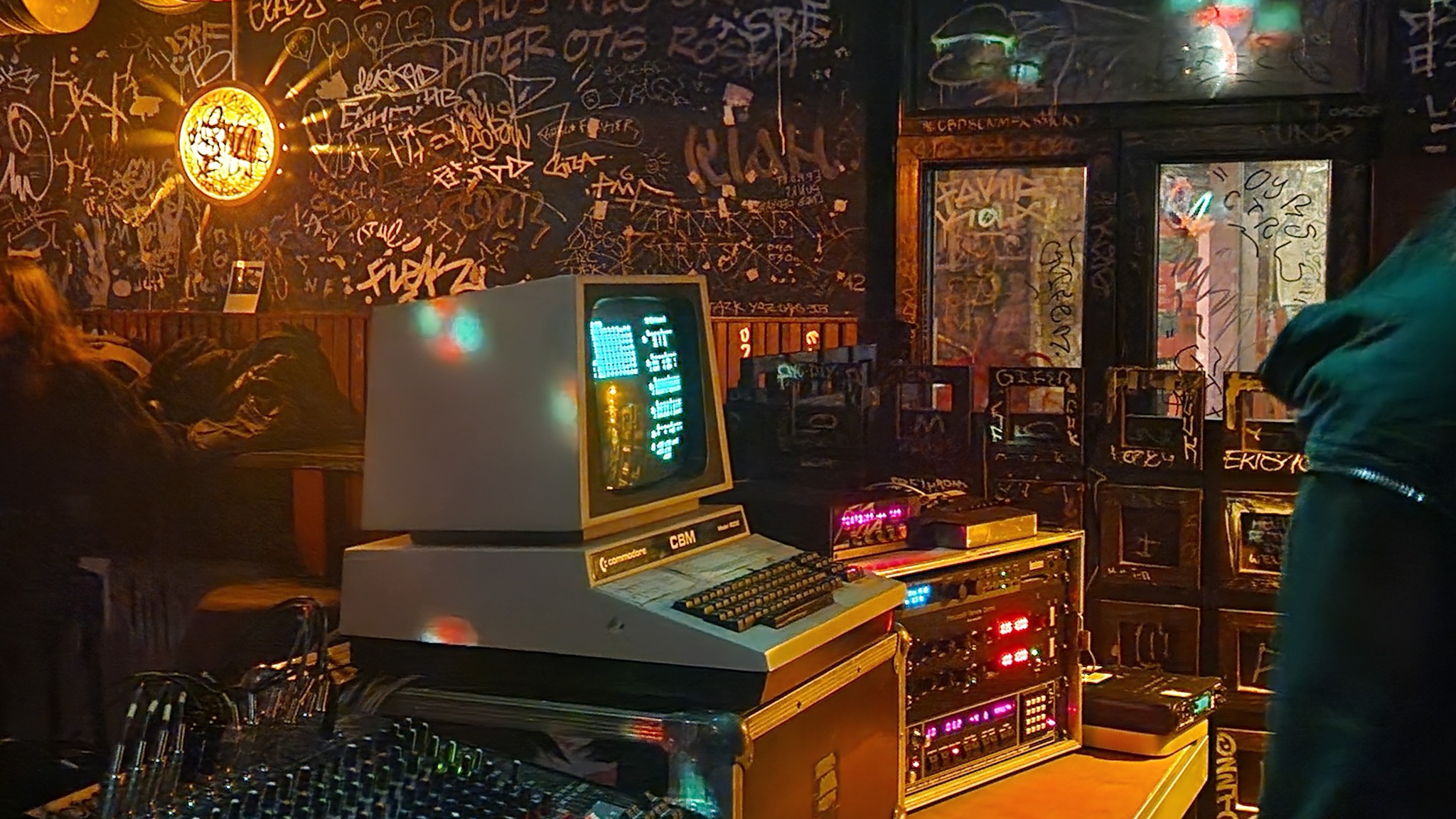 photo of Monolake 8bit performance at Golden Pudel Club in Hamburg, showing a CBM8032 computer running the sequencer and the interior of the club